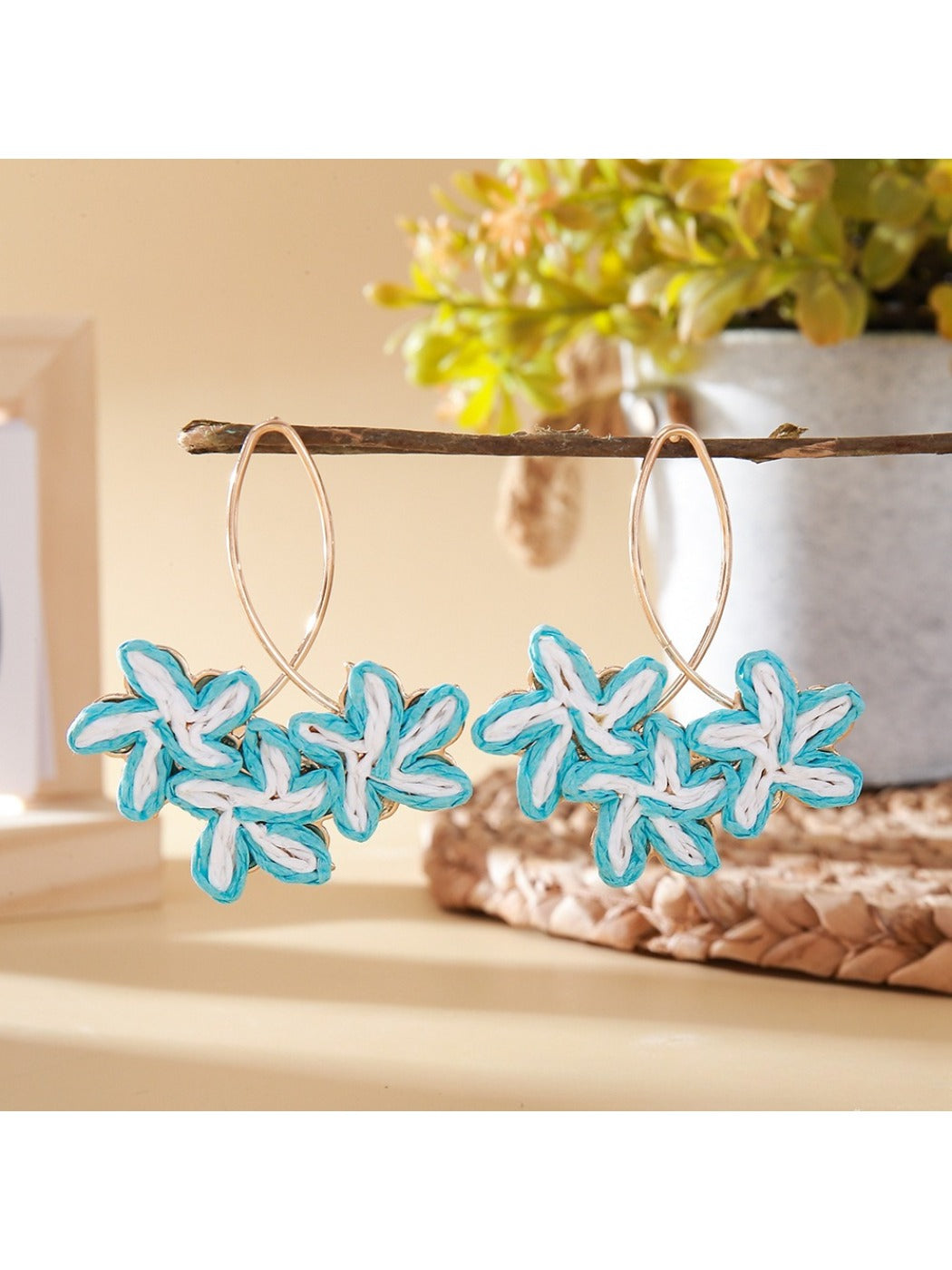 Earedge Sweet Flower Shaped Drop Earrings shown with a soft pink flower background