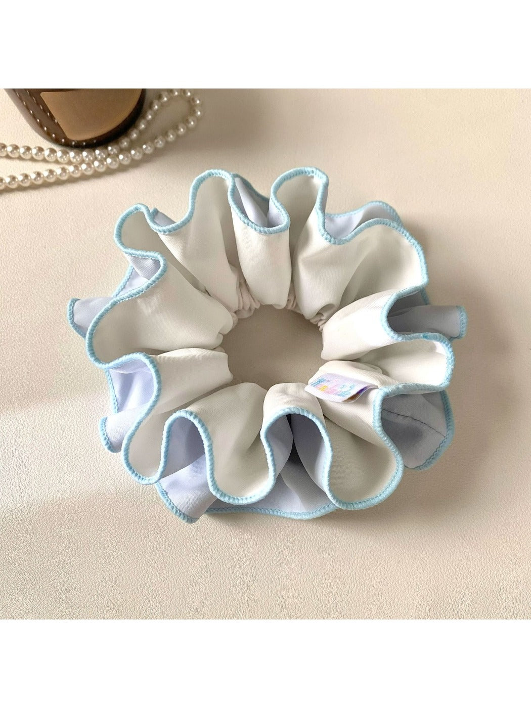 Gifty scrunchie packaged in eco-friendly box with branding visible