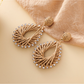 Model wearing Earedge geometric raffia drop earrings with casual outfit