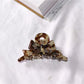 Beau acetate bow shaped claw clip isolated on plain background