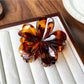 Beau leopard print claw clip partially closed showing teeth