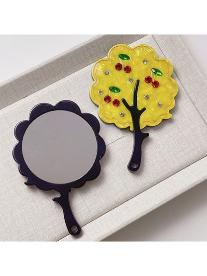 Mirroray handheld mirror with unique tree design shown from above