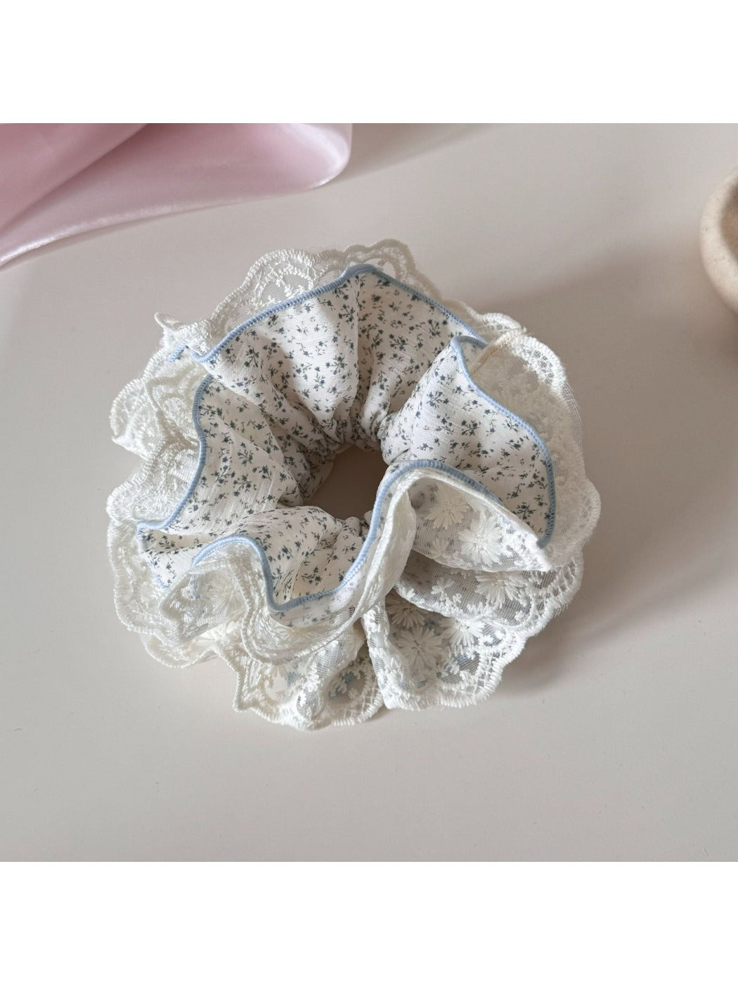Gifty lace trim scrunchie styled in a ponytail with floral pattern