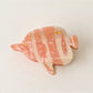 Beau fish claw clip with bright blue and orange colors on a plain white background