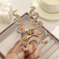 Beau wavy hair clip displayed open showing metal clasp mechanism
