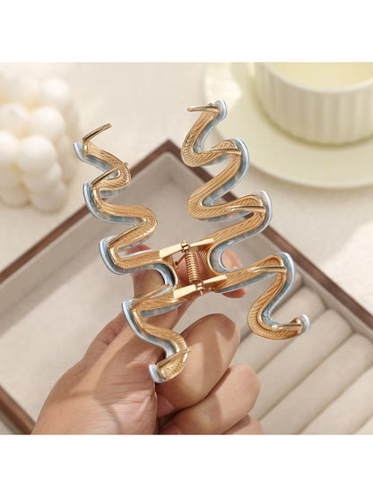 Beau wavy hair clip displayed open showing metal clasp mechanism