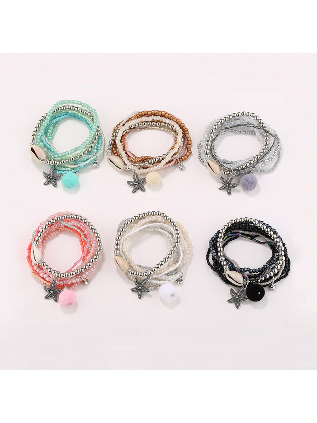 Lovra multi-row small bead bracelet with gold and silver beads on a white background