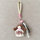 Keypus fabric doll keychain held in hand to show size and texture