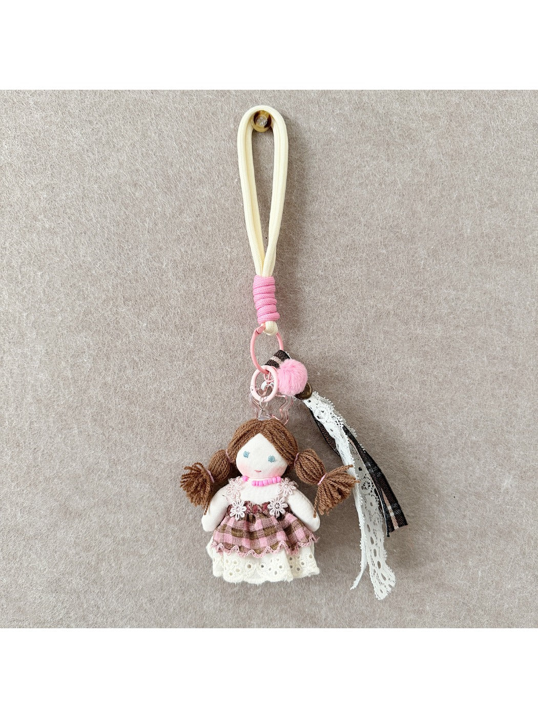 Keypus fabric doll keychain held in hand to show size and texture