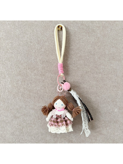 Keypus fabric doll keychain held in hand to show size and texture