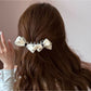 Beau polka dot bow banana clip holding hair in a ponytail