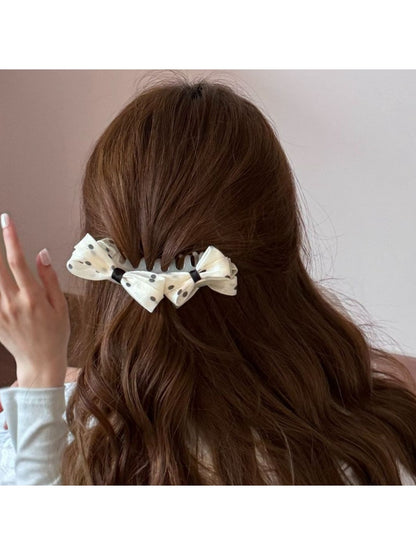 Beau polka dot bow banana clip holding hair in a ponytail