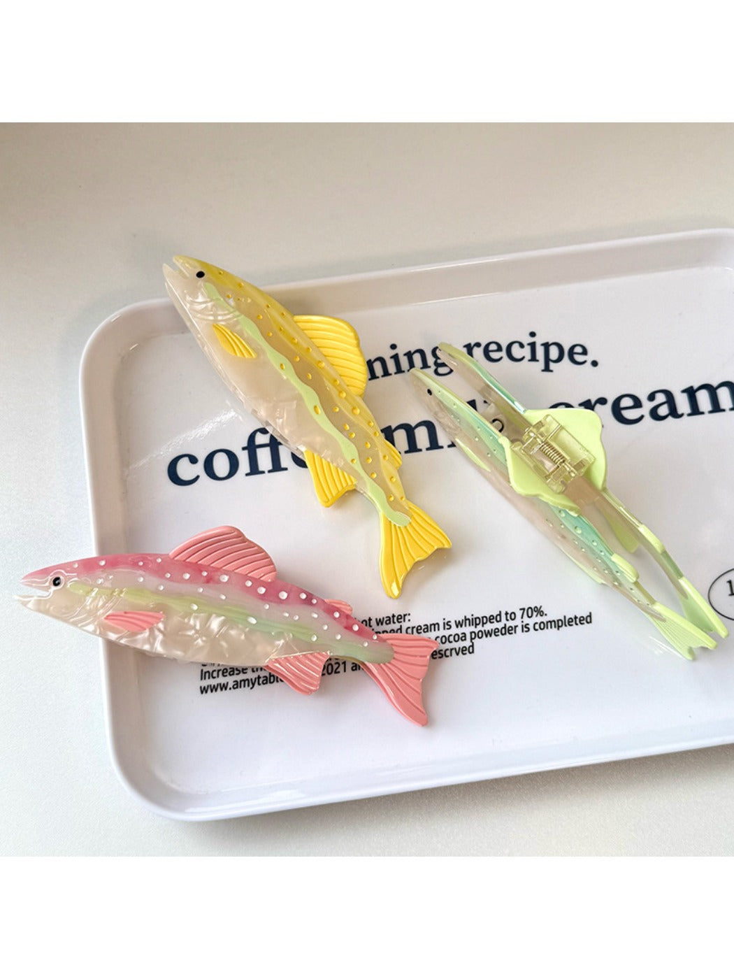 Beau hair claw clip in fish shape displayed on a white background
