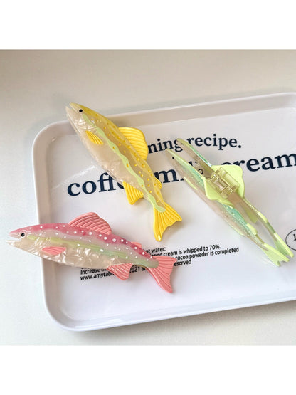 Beau hair claw clip in fish shape displayed on a white background