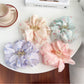 Close-up of Beau hair claw clip highlighting pink and white floral pattern