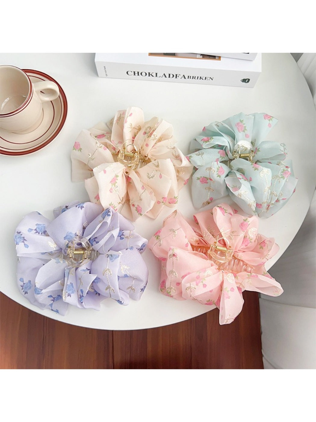 Close-up of Beau hair claw clip highlighting pink and white floral pattern