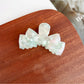 Beau classic bow shaped hair claw clip in beige with smooth curves