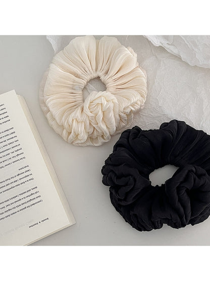 Gifty shimmer scrunchie showing layered fabric texture and elastic band