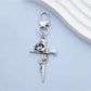 Close-up of rose gold cross keychain showing detailed craftsmanship