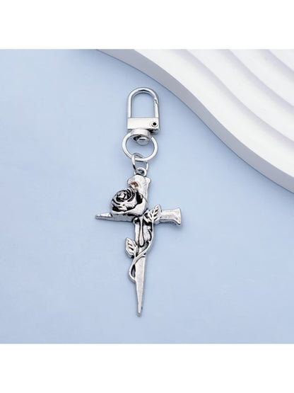 Close-up of rose gold cross keychain showing detailed craftsmanship