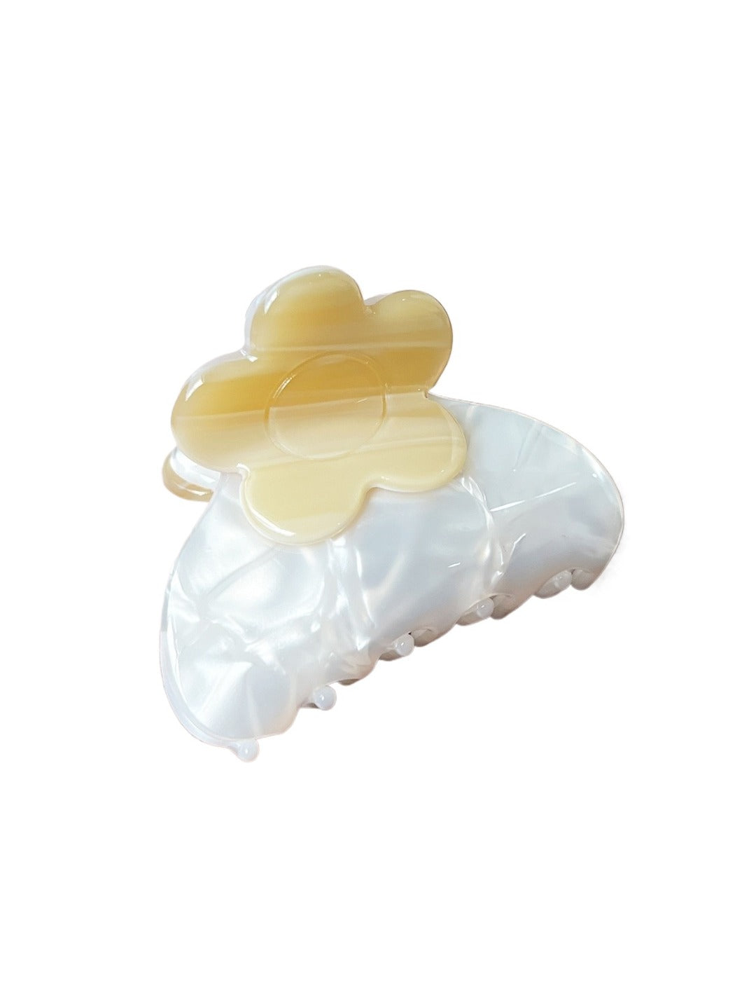 Beau hair clip held in hand showing size and colorful flower design