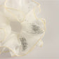 Side view of Gifty minimalist scrunchie highlighting the layered ruffles in pastel color