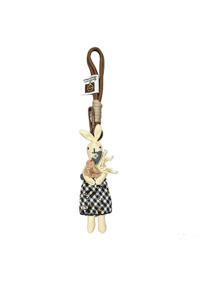 Back view of the fabric rabbit keychain highlighting the keyring attachment