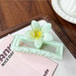 Beau square ombre flower shaped claw clip displayed alongside matching hair accessories