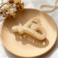 Beau heart shape hair claw holding a ponytail, close-up