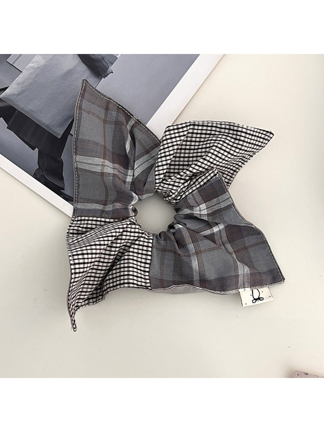 Gifty plaid square scarf scrunchie styled on a wrist with matching outfit