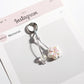 Keypus keychain hanging from a backpack zipper pull