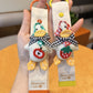 Side view of Keypus duck charm showing detailed facial features and orange beak
