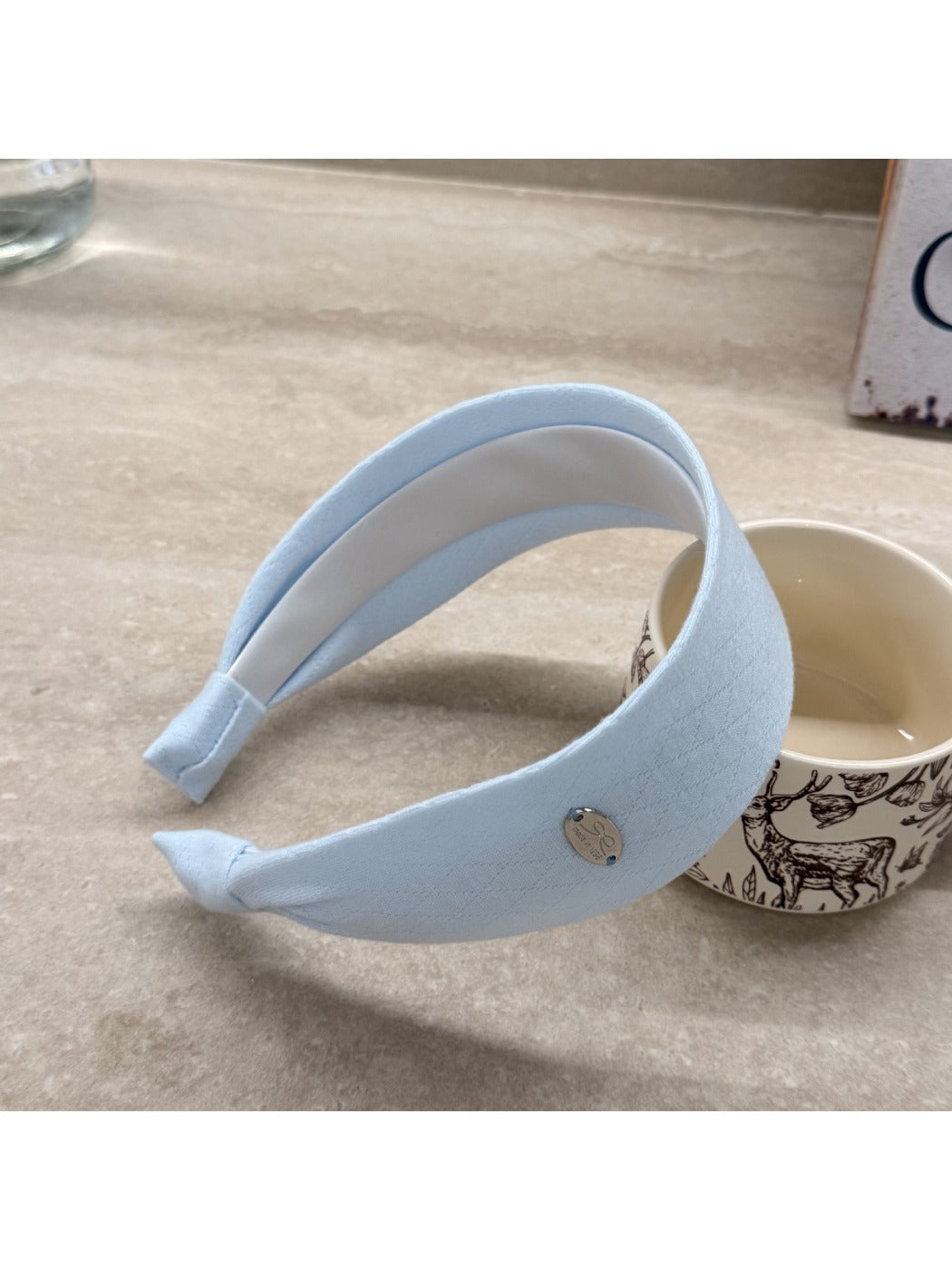Gifty wide solid color headband worn during outdoor activity