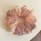 Close-up of Gifty sweet printed double layer scrunchie with floral pattern on white background