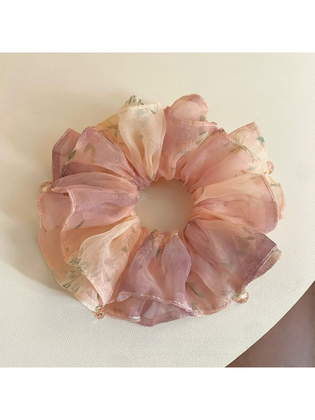 Close-up of Gifty sweet printed double layer scrunchie with floral pattern on white background