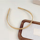 Close-up of Gifty headband’s smooth surface and solid color detail