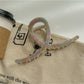 Beau large acetate claw clip resting on a wooden surface with natural light