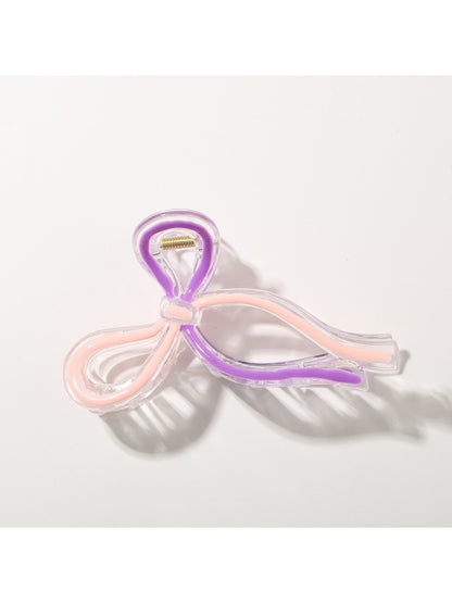 Beau Sweet Ribbon Knot Hair Clip in light pink with subtle fabric sheen