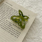 Beau romantic butterfly claw clip displayed against neutral background