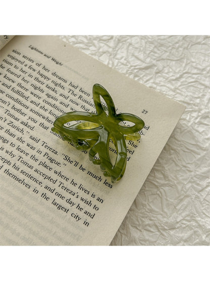 Beau romantic butterfly claw clip displayed against neutral background