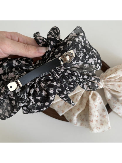 Side view of Beau chiffon bow hair clip highlighting bow shape and volume