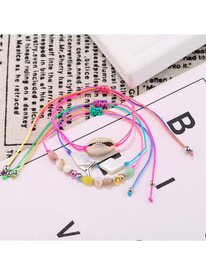 Lovra alloy mermaid tail bracelet coiled to show charm and bead design