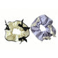 Gifty scrunchie with red ribbon bow styled in a ponytail on a model