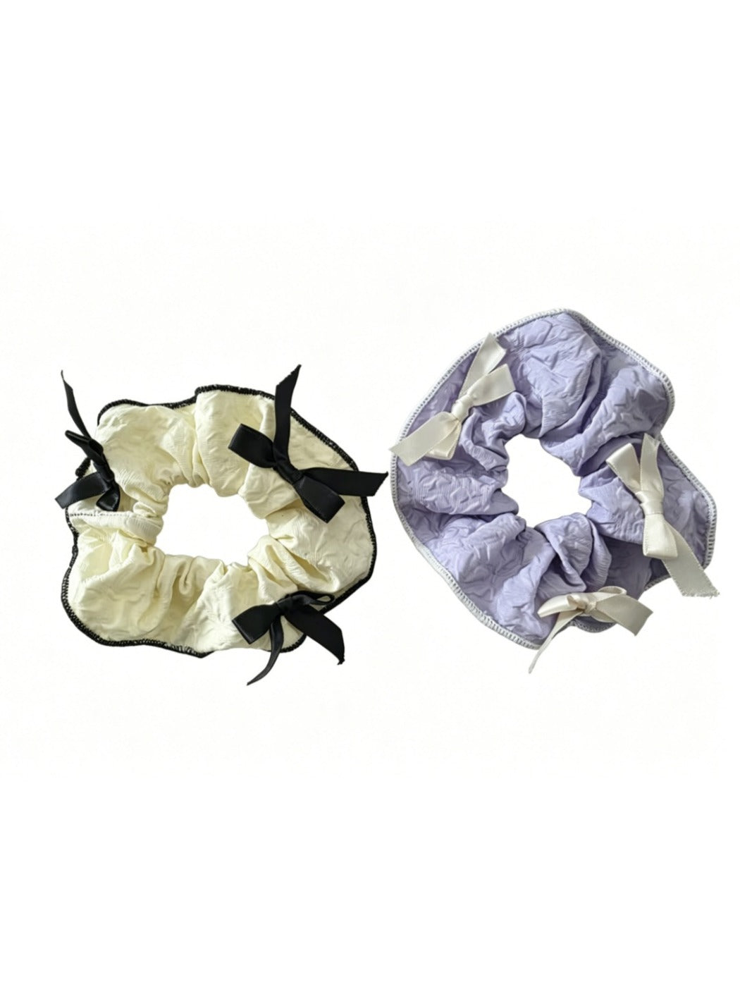 Gifty scrunchie with red ribbon bow styled in a ponytail on a model