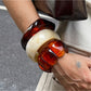 Close-up of Lovra vintage bracelet showing ombre bead details and gold accents