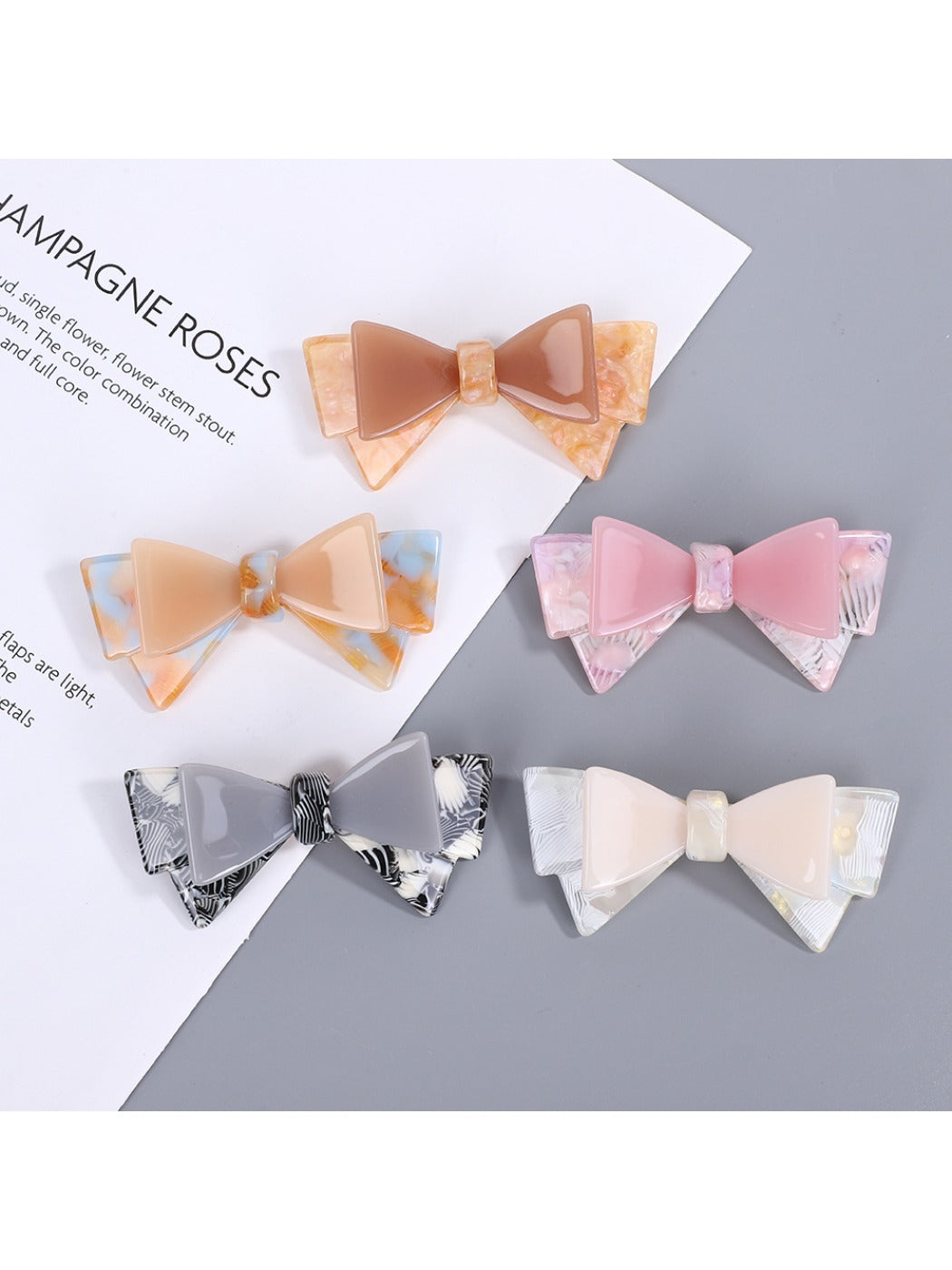 Beau hair clip with a large sweet bow in soft pink fabric