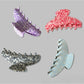Beau claw clip held in hand displaying size and polka dot pattern