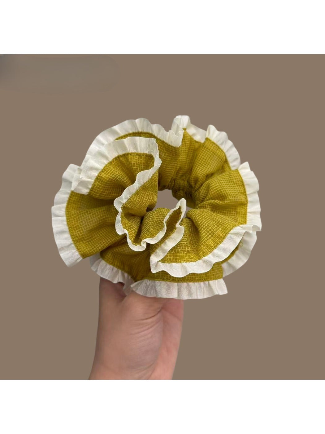 Green plaid scrunchie displayed flat highlighting pattern and trim