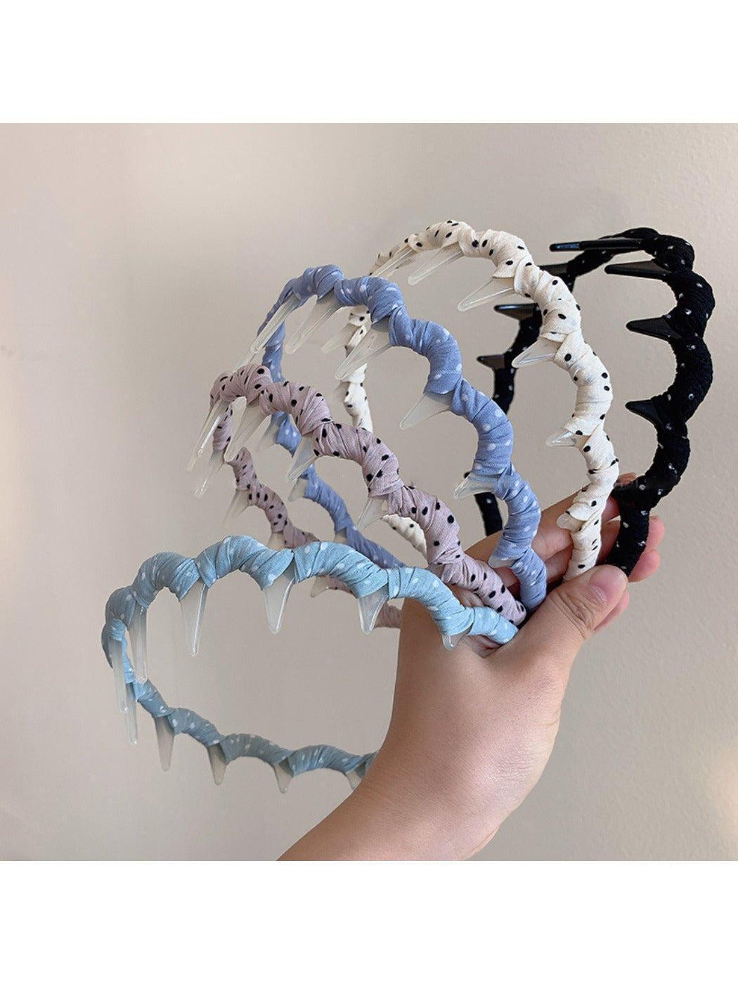 Side view of Gifty polka dot toothed comb headband showing teeth detail