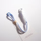Close-up of twisted colorful rope texture on keychain